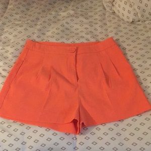Coral pleated shorts